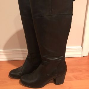 Tall black white mountain high boots